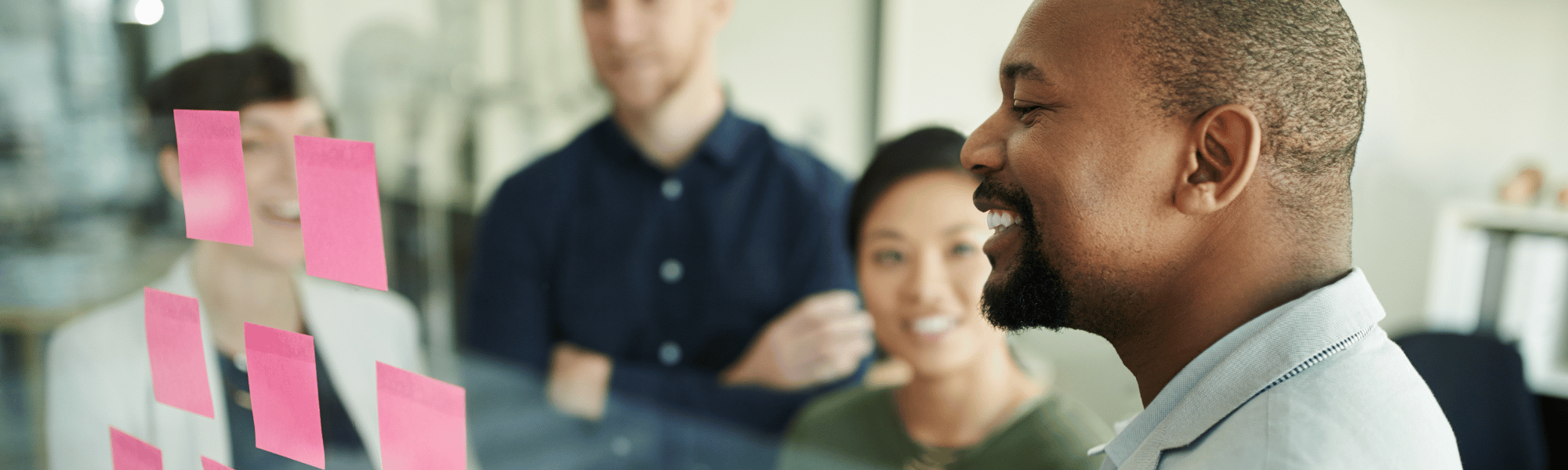 Team members collaborating effectively in a meeting, sharing ideas